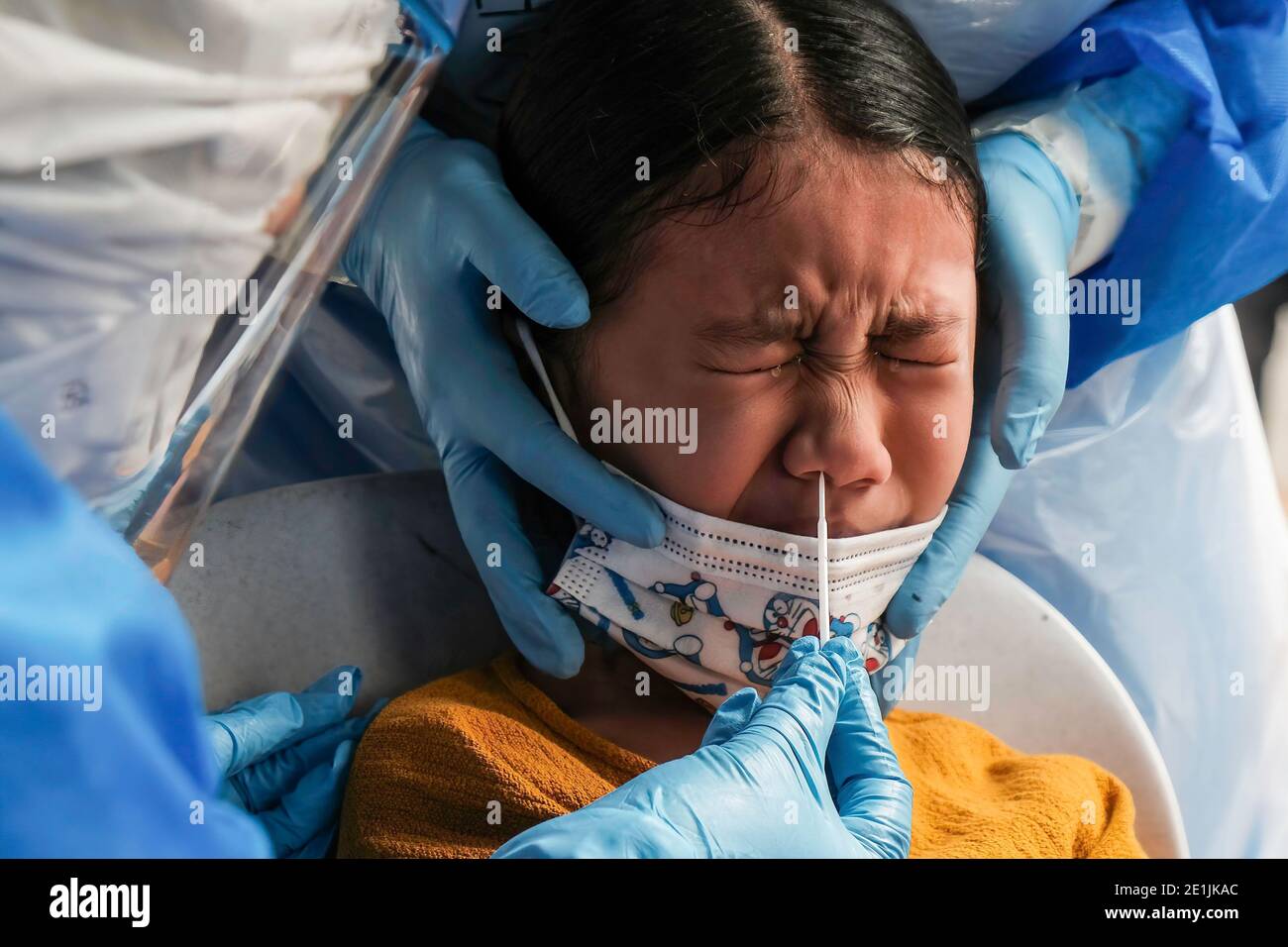 Shah Alam Malaysia 07th Jan 2021 A Medical Worker Wearing A Personal Protective Equipment Ppe Takes A Nasal Swab Sample From A Child During The Covid 19 Screening Test In Shah Alam Malaysia